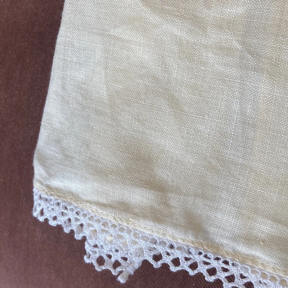 One fine linen embroidered tea towel. A muted butter yellow Vintage 1960s